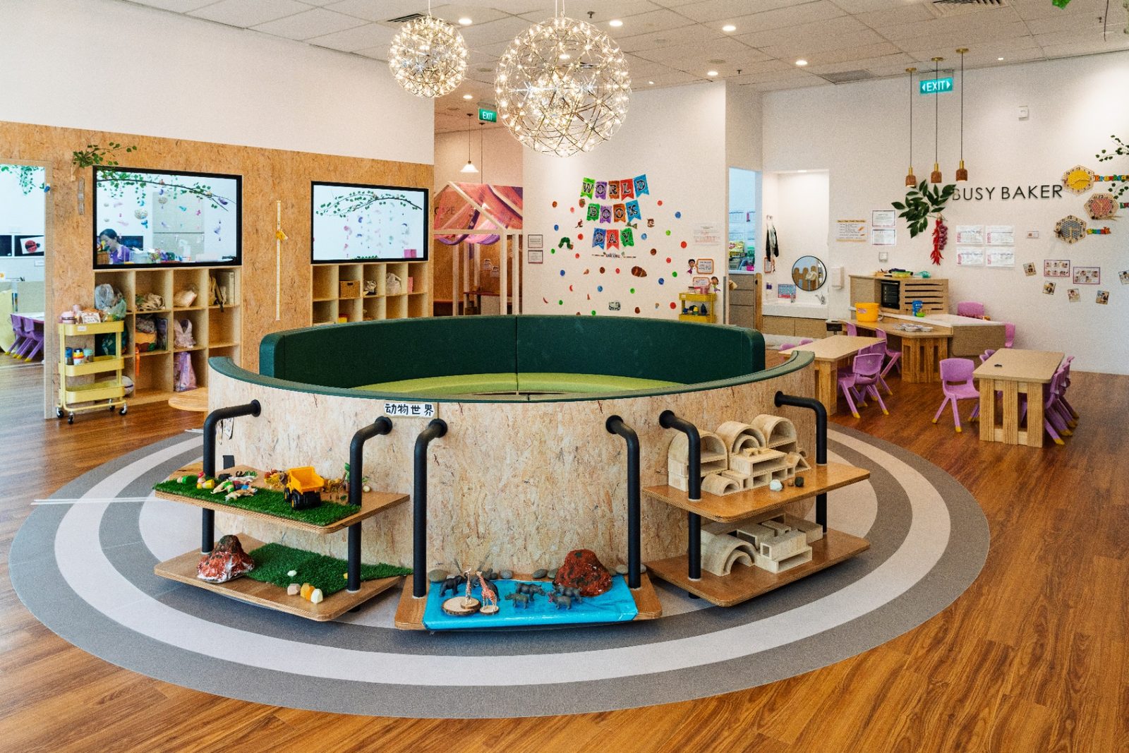 Main learning area with central reading pit and themed play stations
